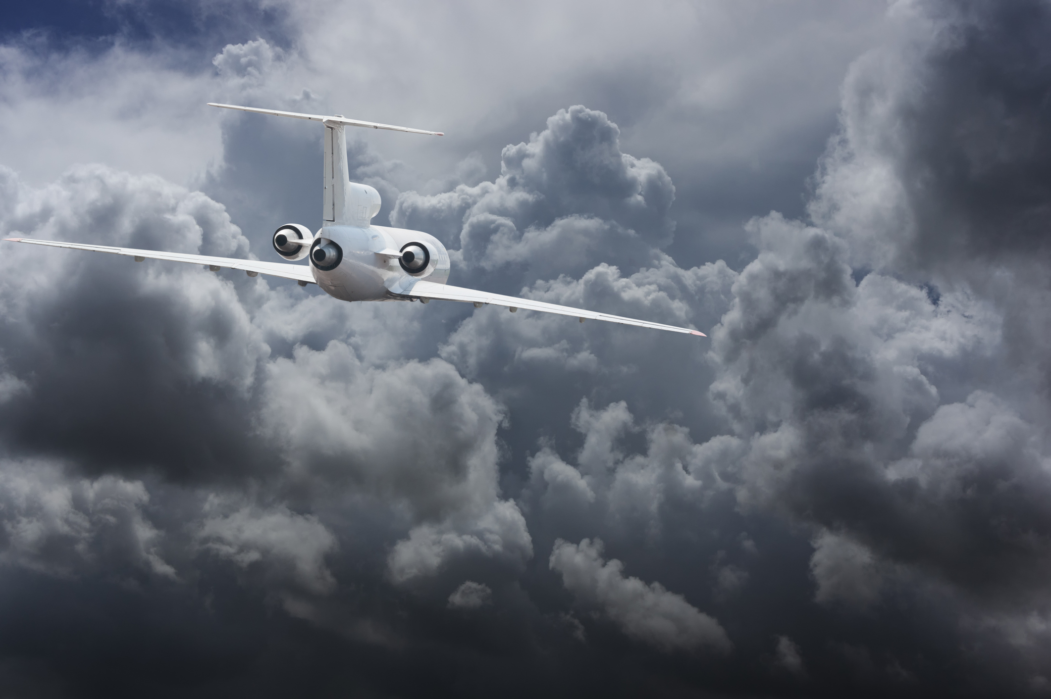 Civil airliner head to thunderstorm clouds