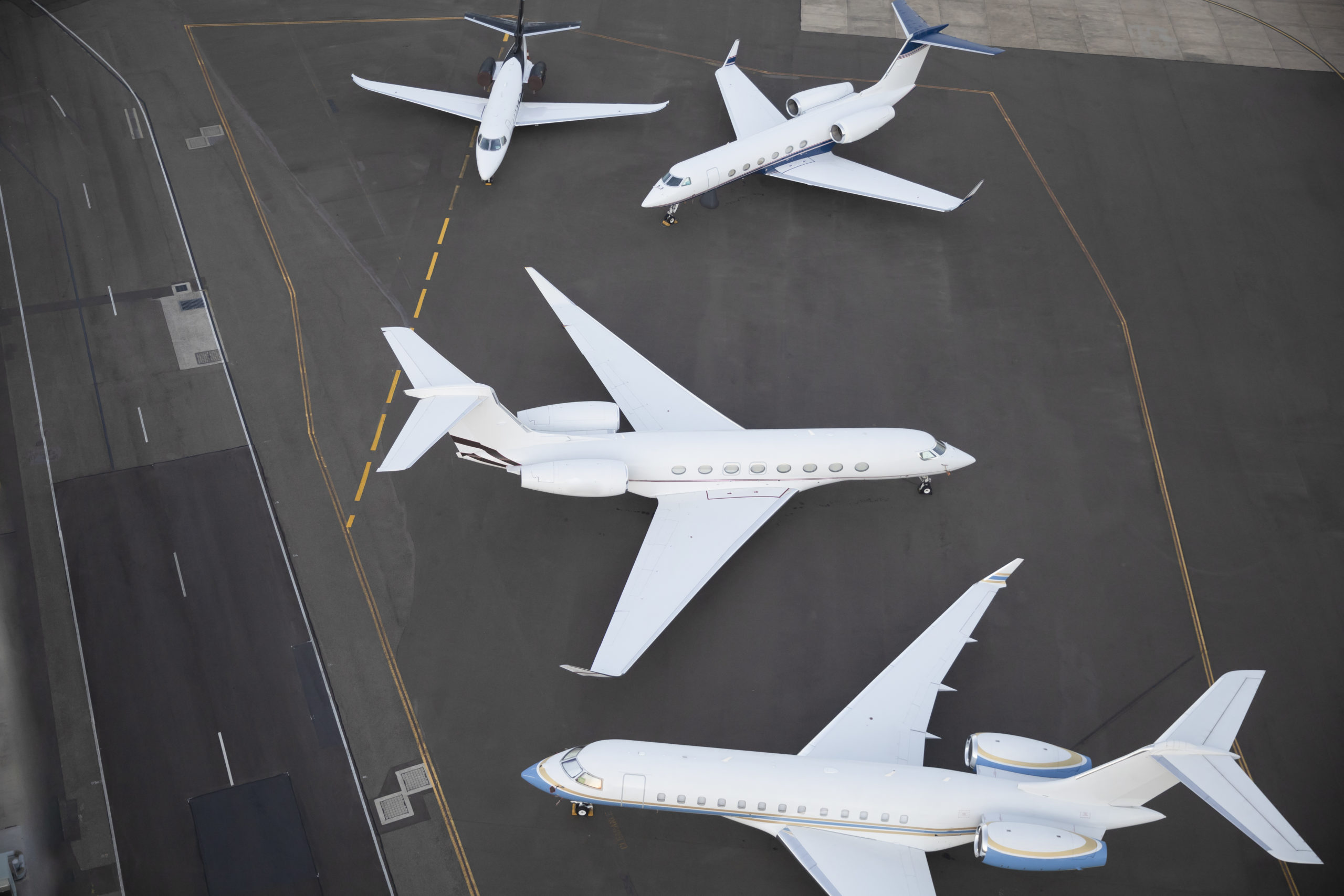 Unbranded aeroplanes waiting on runway